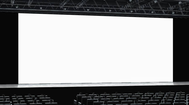 istock Cinema hall with auditorium watching on blank screen mockup 1098002896