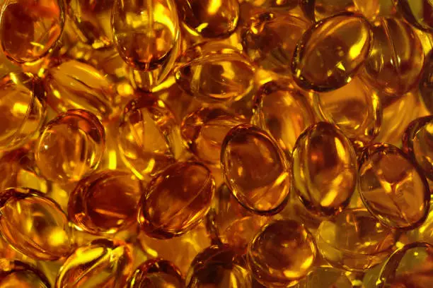 omega 3 capsules fish oil, acids close up for a background