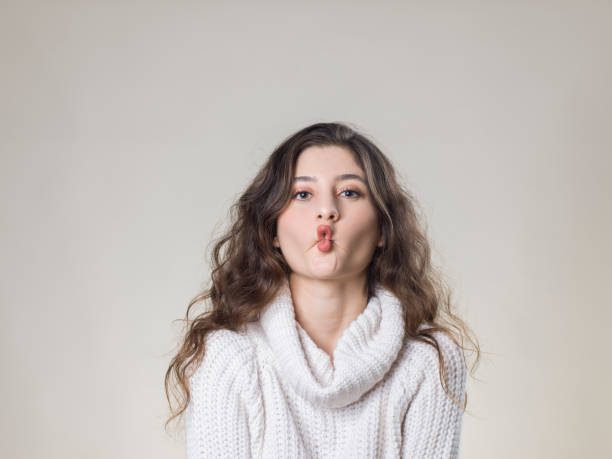 Fish Lips Young woman making a face fish lips stock pictures, royalty-free photos & images