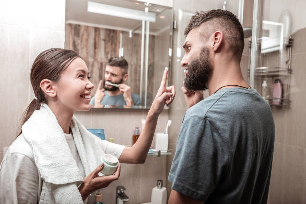 istock Nice cheerful woman looking at her boyfriend 1098010182