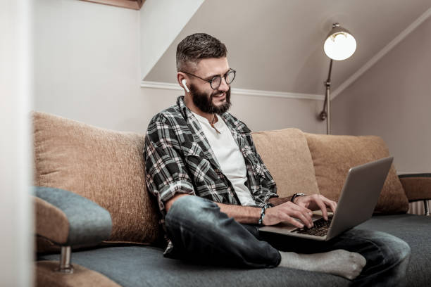istock Joyful happy man typing on his keyboard 1098011820
