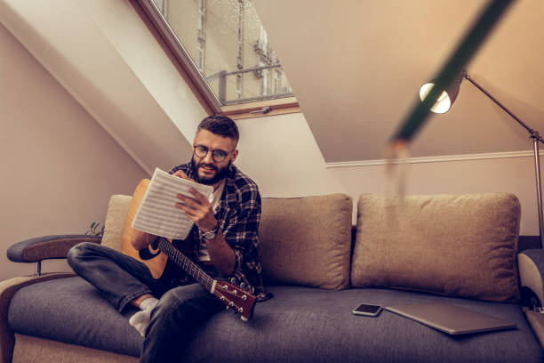 istock Delighted positive man holding his note charts 1098012096