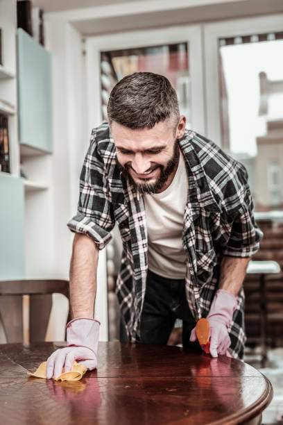 istock Cheerful positive man standing near the table 1098012222