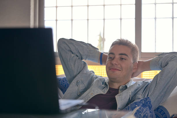 istock Millenial enjoying looking at the computer at home 1098015530
