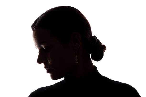 Portrait of a young woman, side view Portrait of a young woman, side view - horizontal silhouette half dressed girls pictures stock pictures, royalty-free photos & images