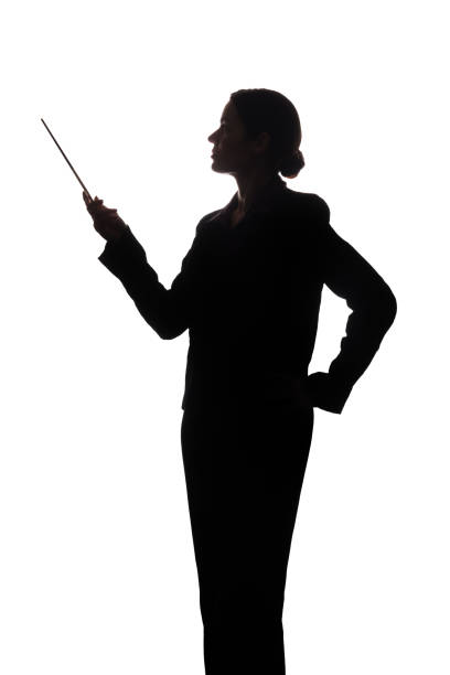 istock Young woman in suit shows pointer forward, side view - silhouette 1098017586