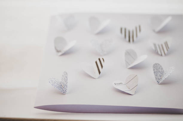Close up of paper butterfly hearts handmade card for Valentine's day
