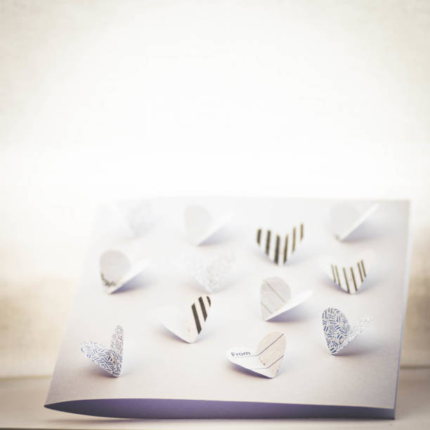 istock Handmade paper butterfly hearts Valentine's card made from old envelope 1098018978