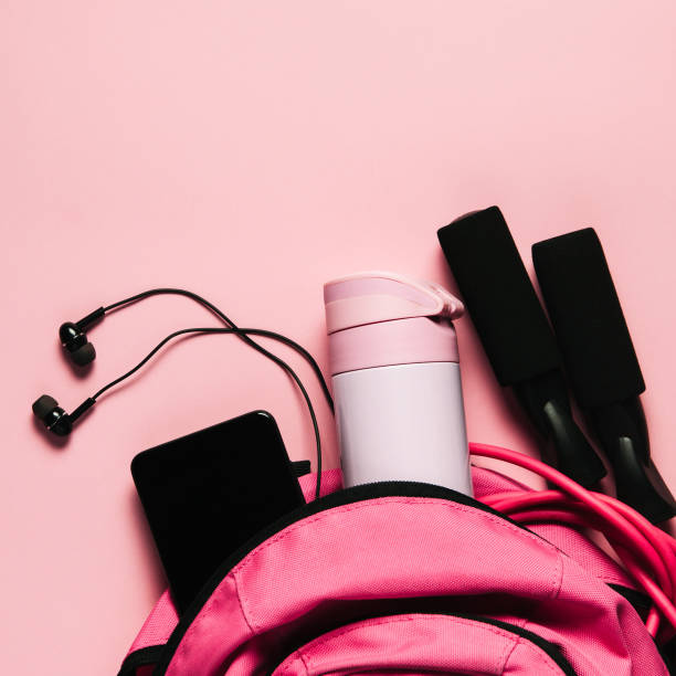 istock Sports bag and accessories on pink background 1098021578