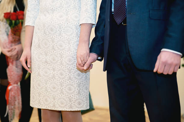 istock Loving couple holding hands at the wedding ceremony 1098026412