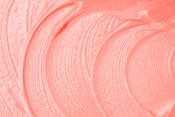 istock Living Coral colored smear of paint texture 1098026528