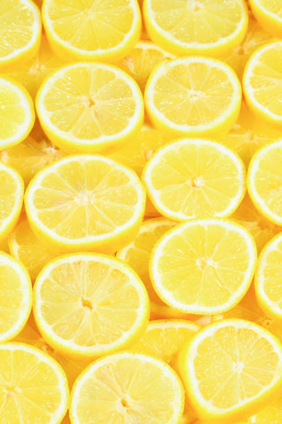 istock A slices of fresh juicy yellow lemons.  Texture background, pattern. 1098026816