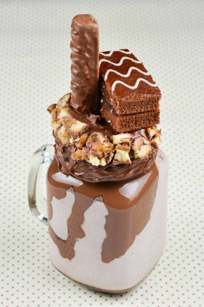 istock Chocolate extreme milkshake with brownie cake, chocolate paste and sweets. Crazy freakshake food trend. Copy space 1098026868
