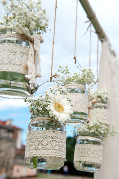 istock Decorative flowers in bulbs hung in a wedding party 1098028008