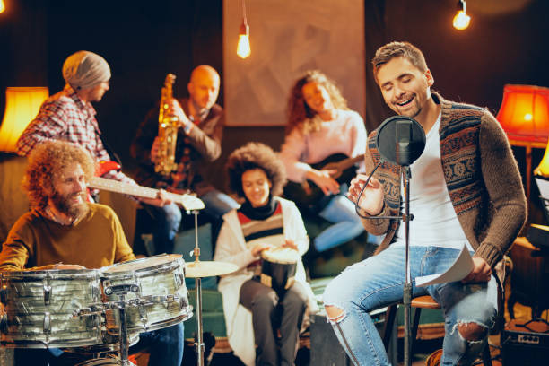 istock Man singing and sitting on chair. 1098030510