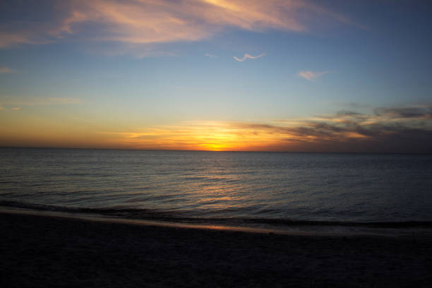 istock sunset over the ocean in Naples Florida 1098030594