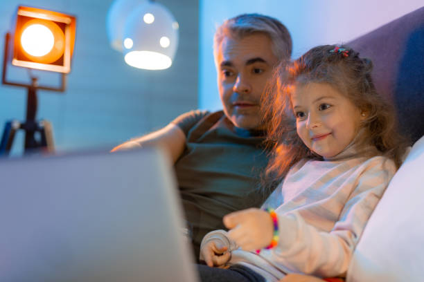 istock Grey-haired father and his small pretty daughter looking excited 1098031926