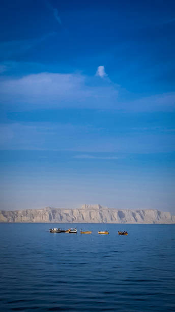 boats fishing in the sea in gawadar, balochistan, pakistan stock photo