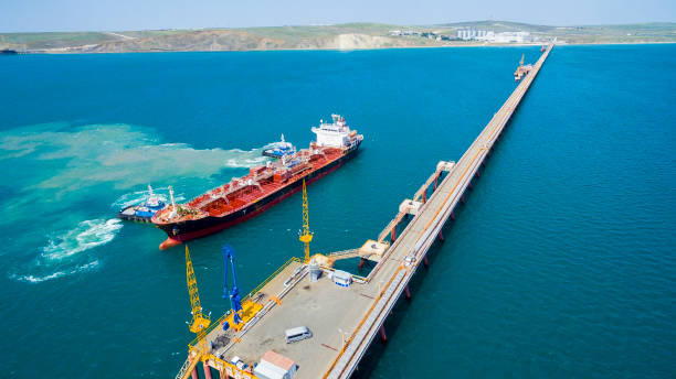 istock tanker moored to the port using tugs from drone 1098035862