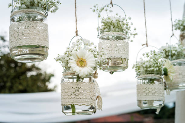 istock Decorative flowers in bulbs hung in a wedding party 1098036098