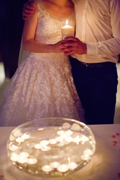 istock bride and groom with candles 1098037938