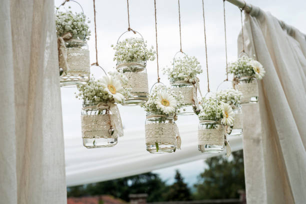 Decorative flowers in bulbs hung in a wedding party stock photo