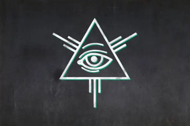 Blackboard with a the All seeing eye symbol drawn in the middle.