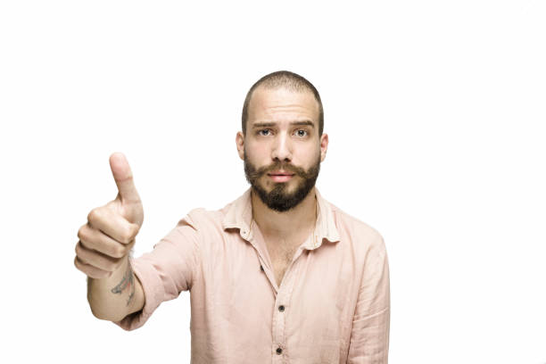 istock Confident handsome young man showing thumbs up 1098058394