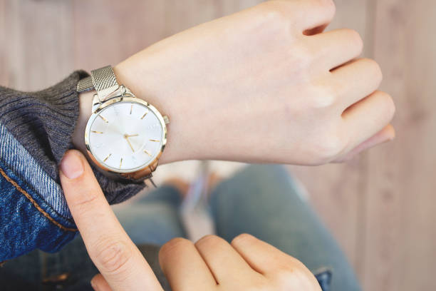 istock Young woman checking time her watch. 1098058594