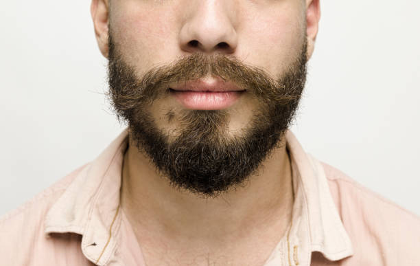 istock Young man with mustache close up 1098060560