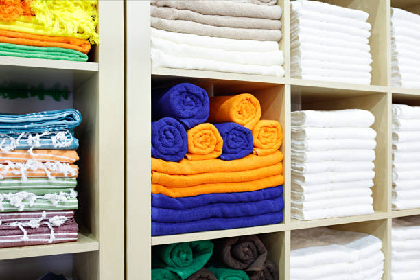 istock Fresh White and colorful Hotel Towels Folded and Stacked on a Shelf 1098061292