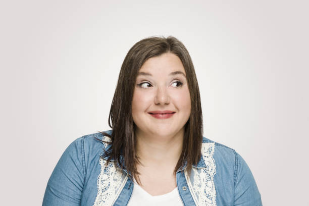 istock Thinking young woman looking away 1098063904