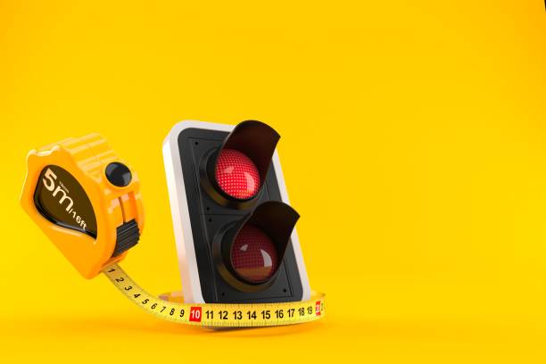 istock Red traffic light with measuring tape 1098066598