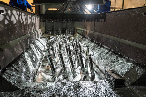 Galvanizing metallic structures in a zinc bath stock photo