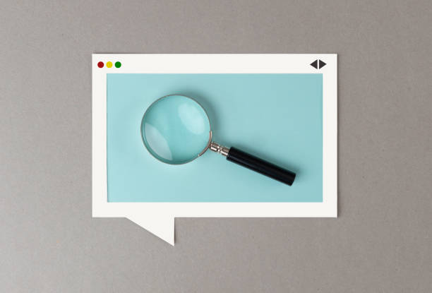 Search Engine Magnifying glass in the paper browser window frame. web browser photos stock pictures, royalty-free photos & images
