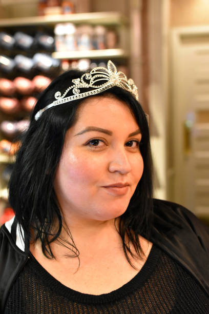 Hispanic Woman with Crown looking at Viewer Melissa Hernandez modeling in Anaheim steven harrie stock pictures, royalty-free photos & images