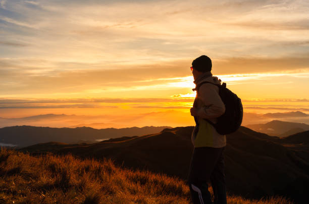 Hiker enjoying beautiful sunrise
