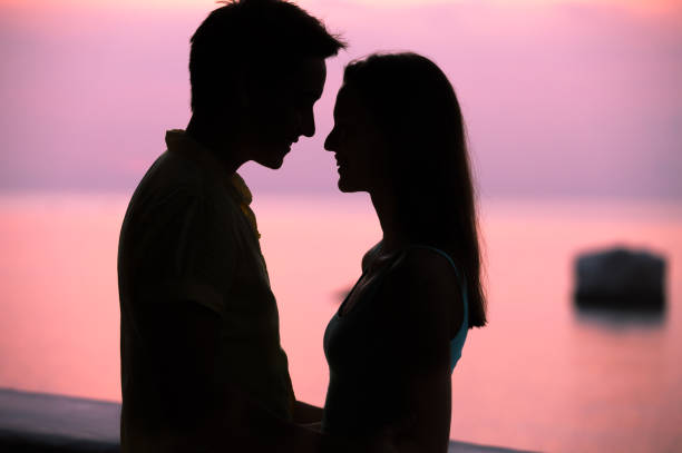 istock Romantic couple at sunset 1098082442