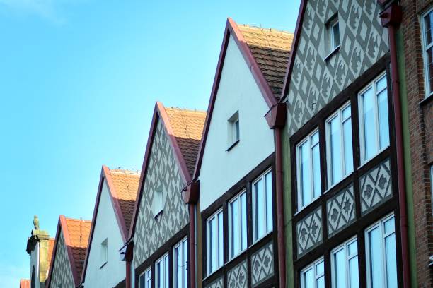 Modern apartment buildings on a sunny day with a blue sky.