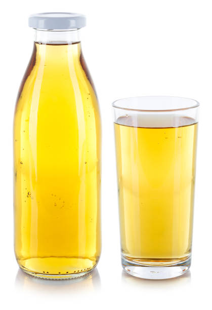Apple juice drink in a bottle and glass isolated on a white background