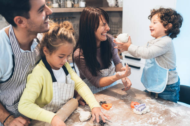 istock Family making cookies in kitchen 1098089528