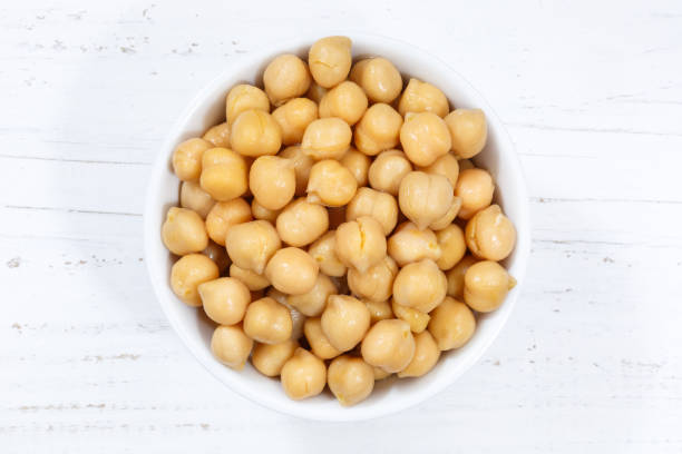 istock Chickpeas peas vegetable vegetables from above bowl wooden board 1098089652