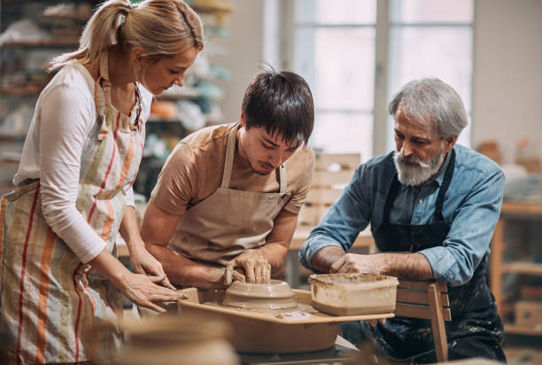 istock young man at  pottery workshop making clay pots 1098103362