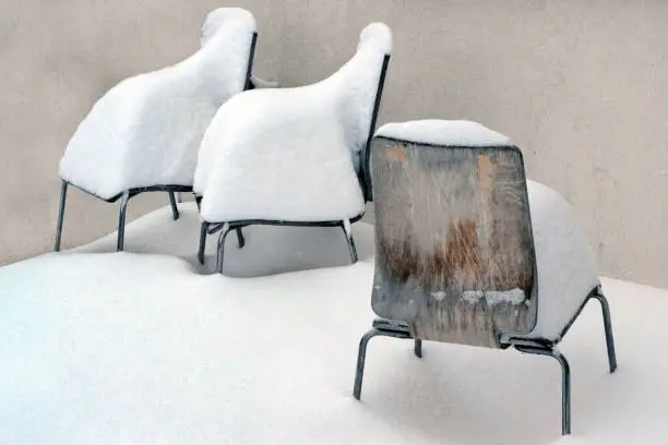 Chairs that have collected snow
