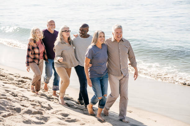 istock Active seniors walking on the beach 1098111786