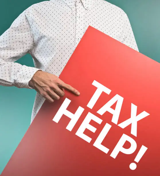 Photo of TAX HELP! / Businessman holding board with text (Click for more)