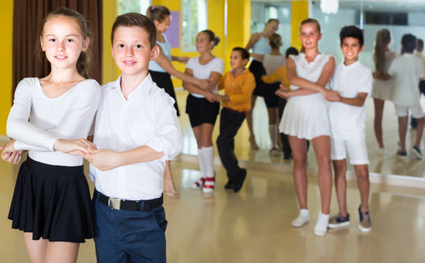 istock Smiling children are dancing in pairs 1098116438