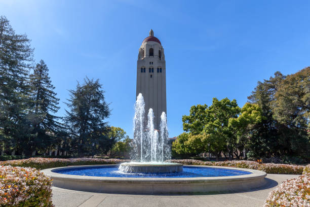 Fountain and Hoover Tower on the campus of Stanford University Stanford, California, USA - March 29, 2018: Fountain and Hoover Tower on the campus of Stanford University in Stanford, California. stanford university photos stock pictures, royalty-free photos & images