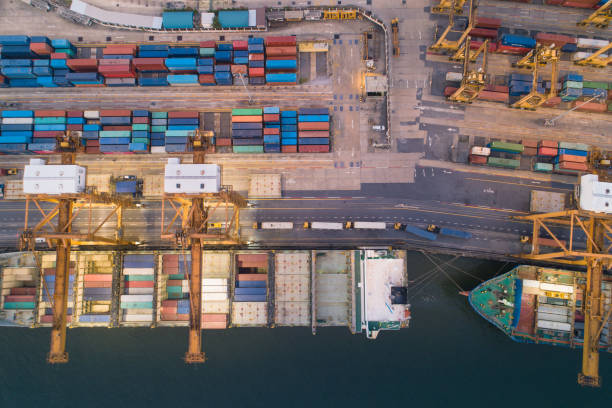 istock Logistics and transportation of Container Cargo ship and Cargo working crane bridge in shipyard 1098140748