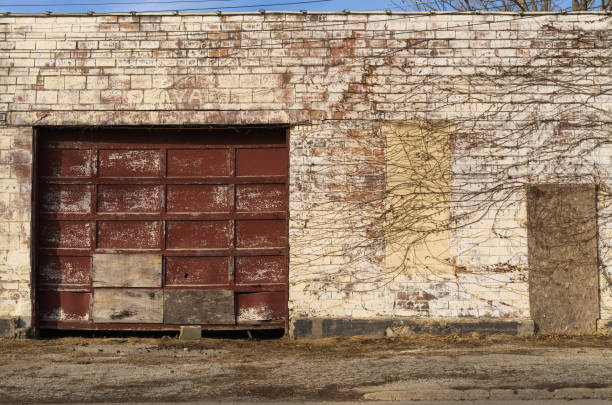 istock Old garage door and brick wall 1098150674